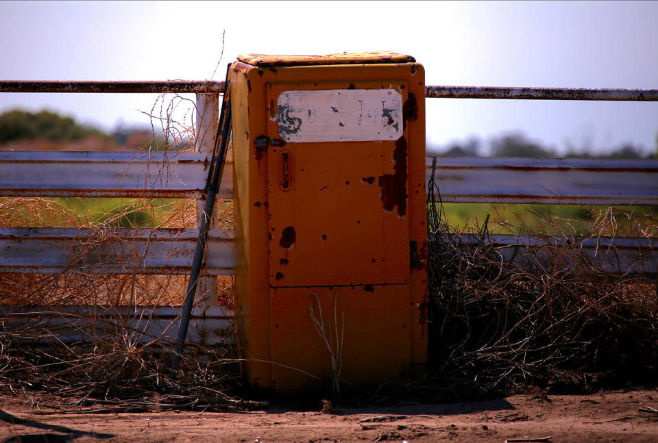 <p>An old refrigerator haa been repurposed as a mailbox on a road in the outskirts of Walgett township, northwest of Sydney, Australia. (Photo: David Gray/Reuters) </p>