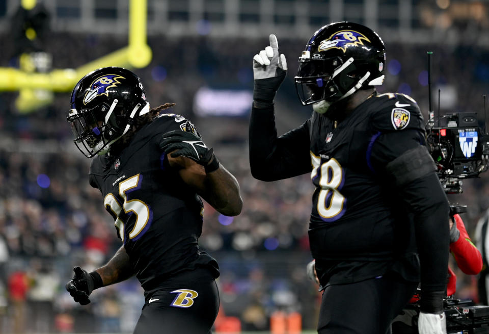 Nov 16, 2023; Baltimore, Maryland, USA; Baltimore Ravens running back Gus Edwards (35) and offensive tackle <a class="link " href="https://sports.yahoo.com/nfl/players/27594" data-i13n="sec:content-canvas;subsec:anchor_text;elm:context_link" data-ylk="slk:Morgan Moses;sec:content-canvas;subsec:anchor_text;elm:context_link;itc:0">Morgan Moses</a> (78) celebrate after a touchdown during the first quarter against the Cincinnati Bengals at M&T Bank Stadium. Mandatory Credit: Tommy Gilligan-USA TODAY Sports