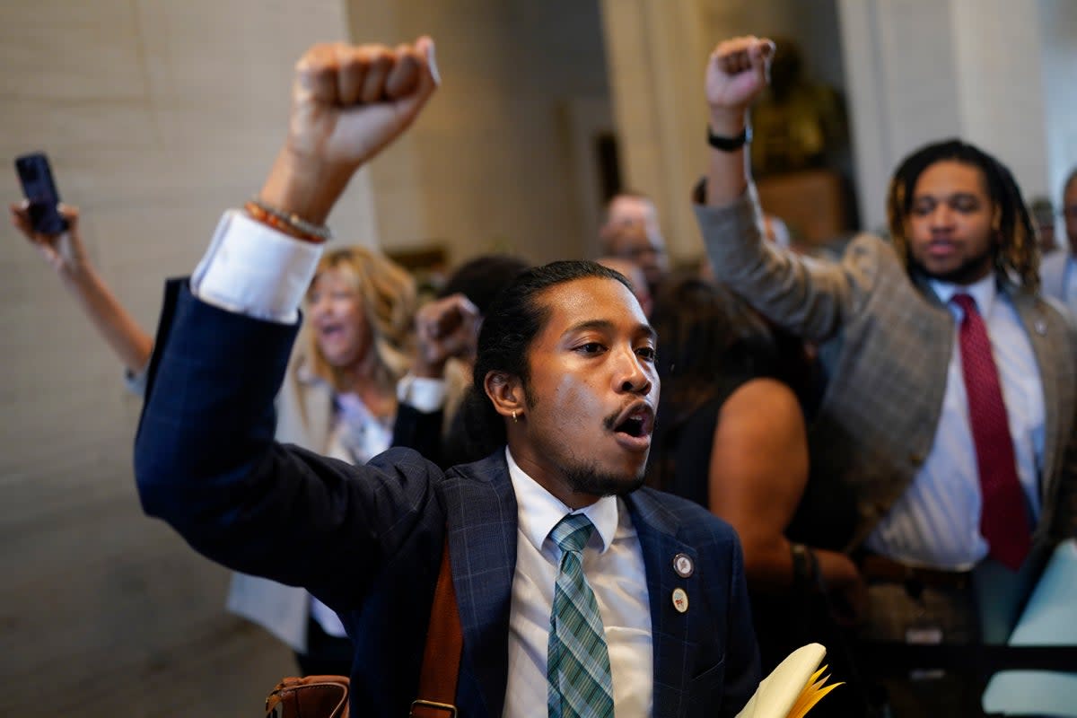 Justin Jones raises his fist to supporters outside the House chamber during a special session of the state legislature on public safety Monday, on 28 August, 2023  (Copyright 2023 The Associated Press. All rights reserved)