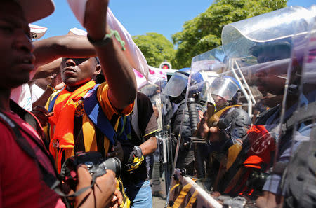 Students protest outside the parliament ahead of South African Finance Minister Pravin Gordhan's medium term budget speech in Cape Town, South Africa October 26, 2016. REUTERS/Sumaya Hisham