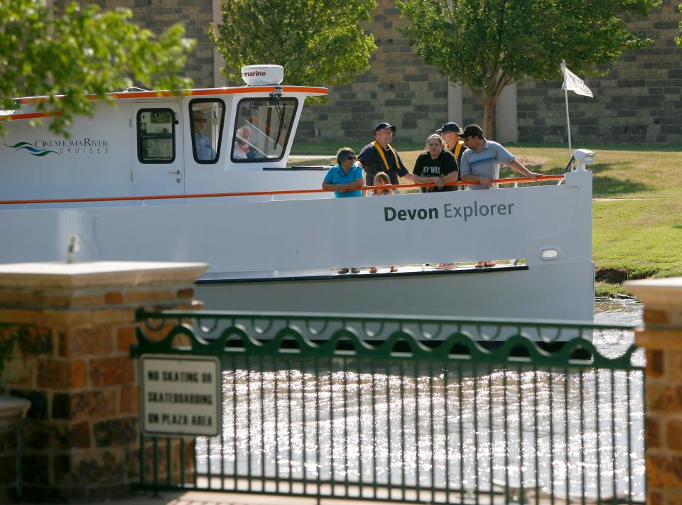 Passengers finish their ride on a boat with Oklahoma River Cruises at Regatta Park in Oklahoma City.