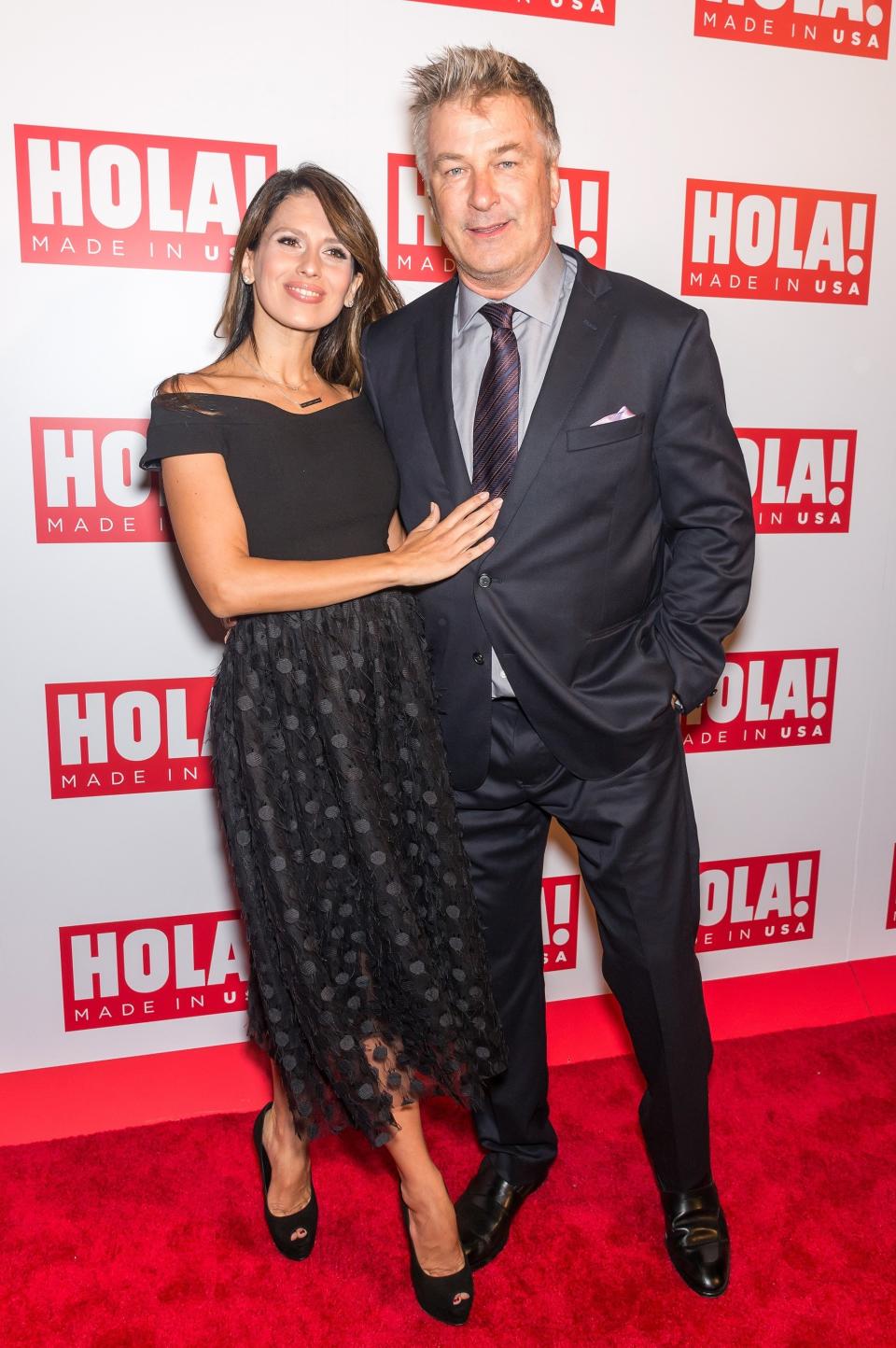 Hilaria and Alec Baldwin stand together at an event