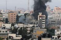 Smoke rises following an Israeli air strike on a building, amid a flare-up of Israeli-Palestinian fighting, in Gaza City