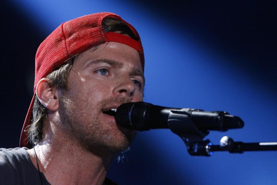 FILE - This June 7, 2013 file photo shows Kip Moore on day 2 of the 2013 CMA Music festival at the LP Field in Nashville, Tenn. Moore, along with Brett Eldredge, and Justin Moore are vying for the fan-voted best new artist award at the Academy of Country Music Awards on Sunday, April 6, 2014, in Las Vegas. (Photo by Wade Payne/Invision/AP, File)