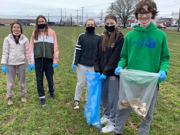 Sam Gillis, right, and other students at Birchwood Intermediate remebered Josh Underhay as a 'great teacher' who cared deeply about the environment. (Laura Meader/CBC - image credit)