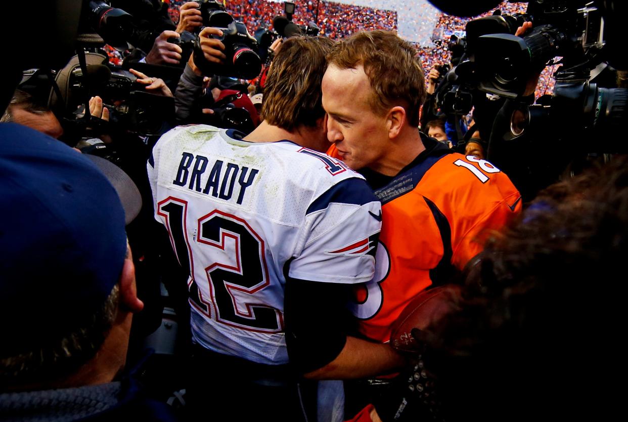New England Patriots quarterback Tom Brady and Denver Broncos quarterback Peyton Manning shake hands and speak after the 2016 AFC Championship game at Mile High Stadium.