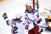 New York Rangers' Alexis Lafrenière (13) celebrates his goal during the first period in Game 4 of an NHL hockey Stanley Cup first-round playoff series against the Pittsburgh Penguins in Pittsburgh, Monday, May 9, 2022. (AP Photo/Gene J. Puskar)