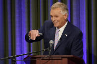 Democratic gubernatorial candidate former Governor Terry McAuliffe, waves to supporters at the start of a debate at the Appalachian School of Law in Grundy, Va., Thursday, Sept. 16, 2021. (AP Photo/Steve Helber)