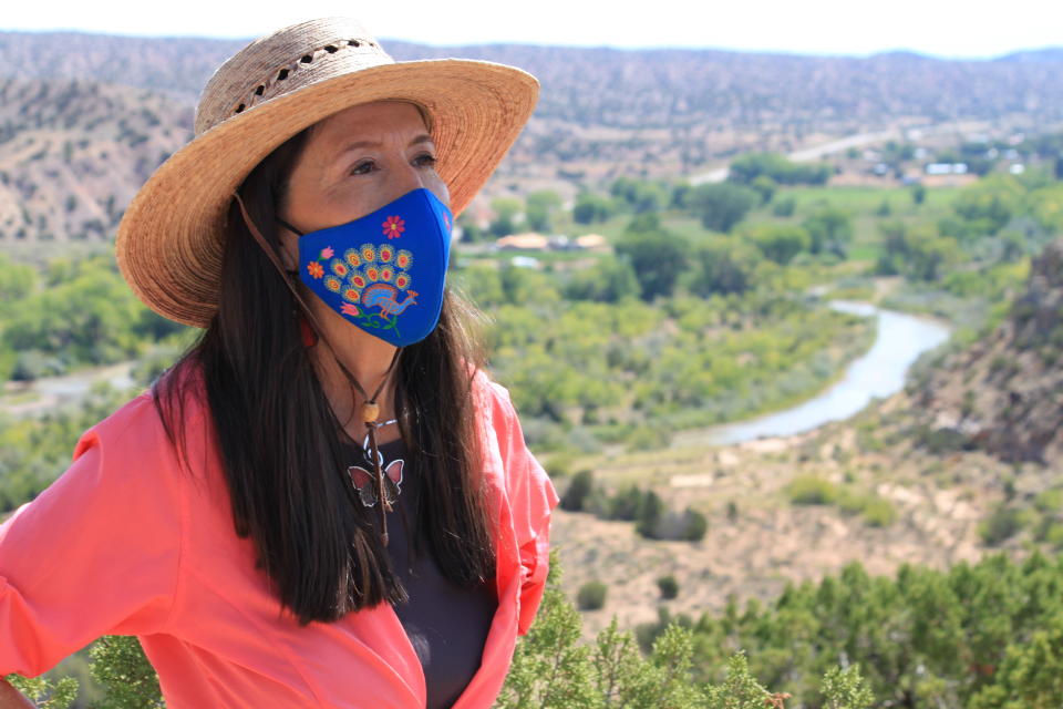 This Aug. 31, 2021 photo shows U.S. Rep. Teresa Leger Fernández during a tour of the Rio Chama valley near Abiquiu, New Mexico. Leger Fernández said the traditional irrigation systems known as acequias that supply small farms throughout the region with water hold a cultural and historic significance and need to be preserved. (AP Photo/Susan Montoya Bryan)