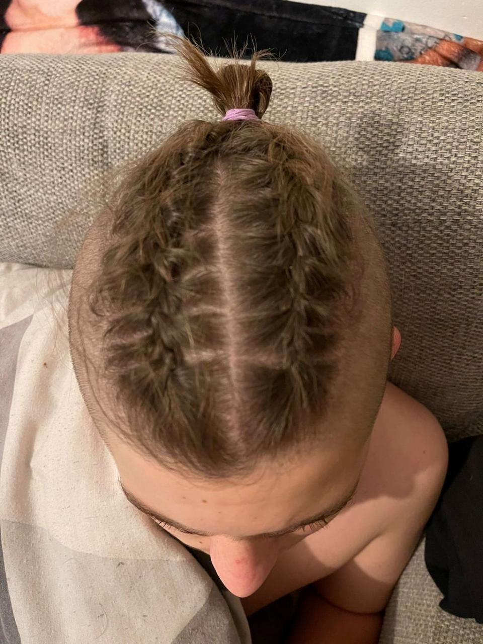 Lealan Hague, 14, was placed in isolation at Exmouth Community College after turning up with his hair in plaits (Kirsty Hague/SWNS)