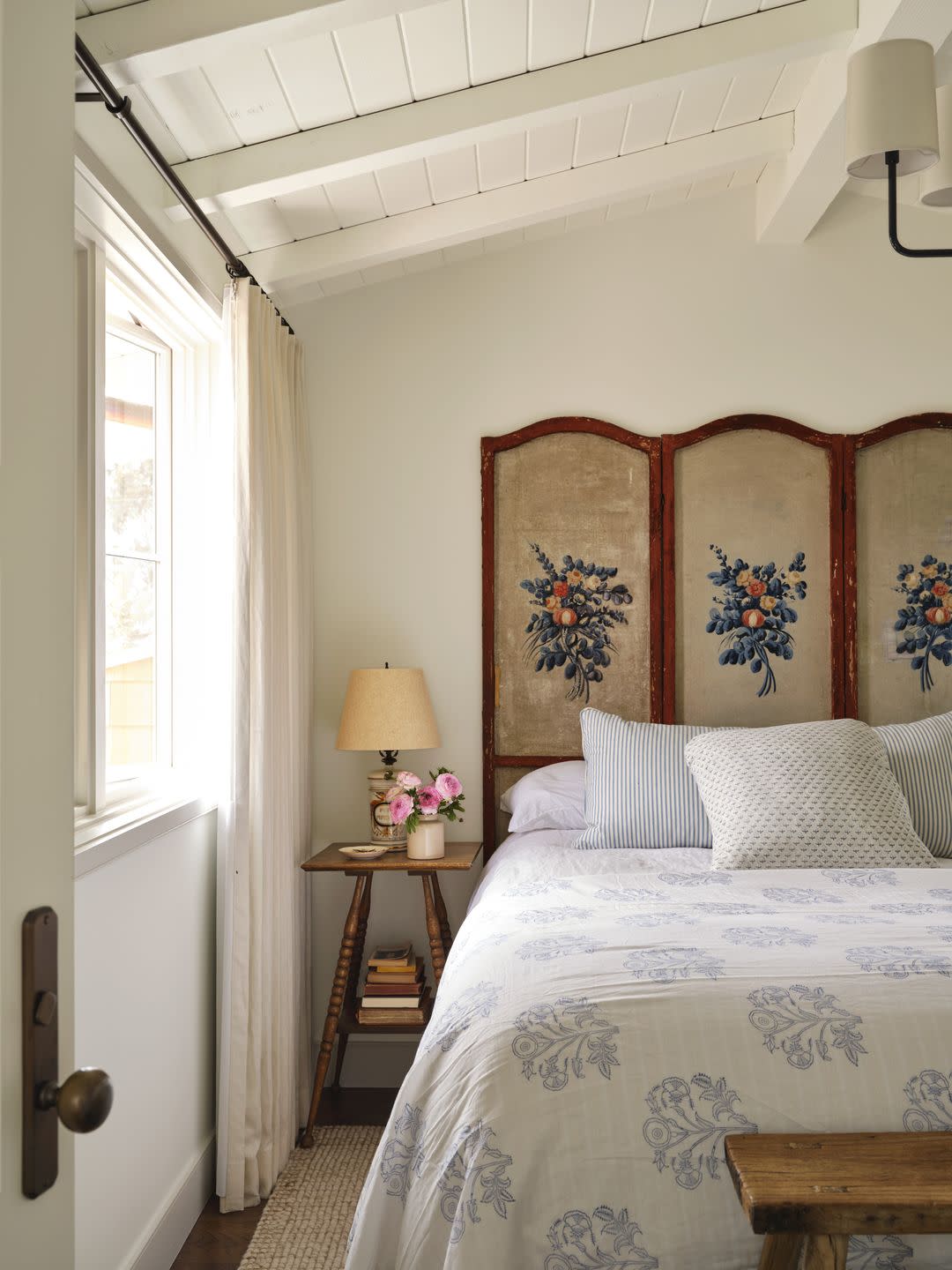 del mar california cottage bedroom with an antique screen as a headboard