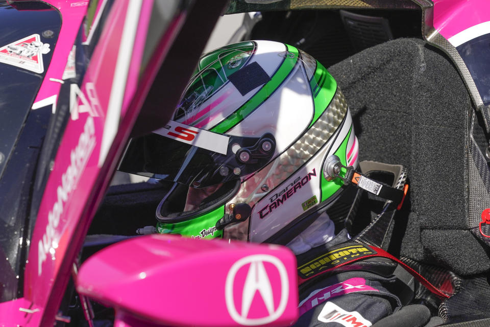 Dane Cameron prepares to go out on the track for a turn driving during a practice session for the Rolex 24 hour race at Daytona International Speedway, Friday, Jan. 29, 2021, in Daytona Beach, Fla. (AP Photo/John Raoux)