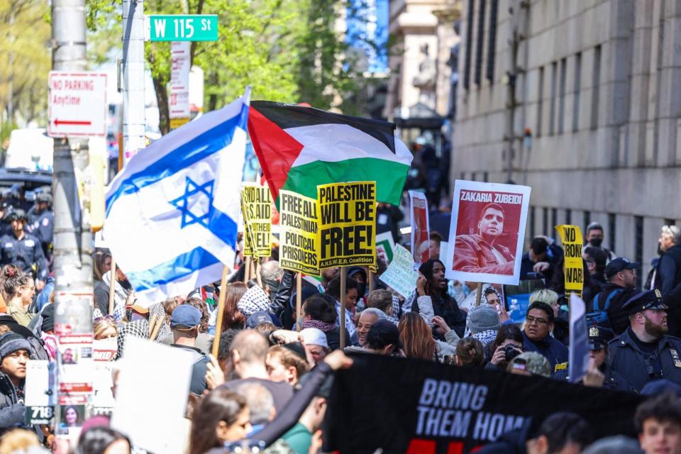 PHOTO: Pro-Palestinian and Pro-israel face off in front of the entrance of Columbia University which is occupied by Pro-Palestinian protesters in New York on April 22, 2024. (Charly Triballeau/AFP via Getty Images)