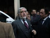 Afghanistan's presidential candidate Abdullah Abdullah leaves a gathering after his speech on the final presidential election results in Kabul