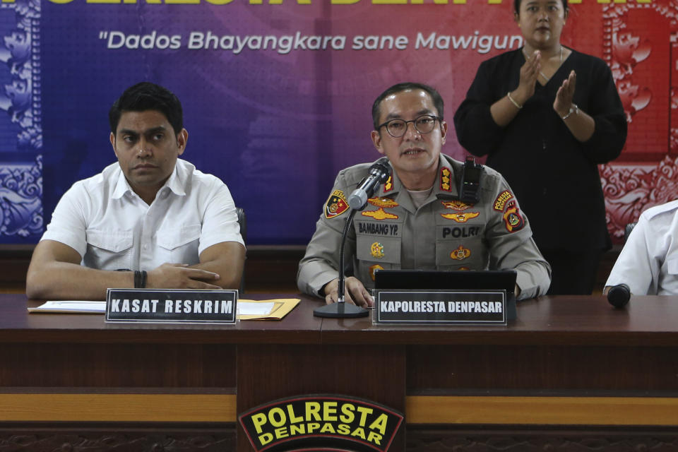 Denpasar District Police Chief Col. Bambang Yugo Pamungkas, right, speaks to the media as Chief Detective Maj. Losa Lusiano Araujo, left, listens during a press conference in Denpasar, Bali, Indonesia, Wednesday, May 17, 2023. Indonesian police investigating the deaths of two Chinese tourists whose bodies were found at a hotel in the resort island of Bali said Wednesday that the boyfriend of the woman killed her before killing himself. (AP Photo/Firdia Lisnawati)