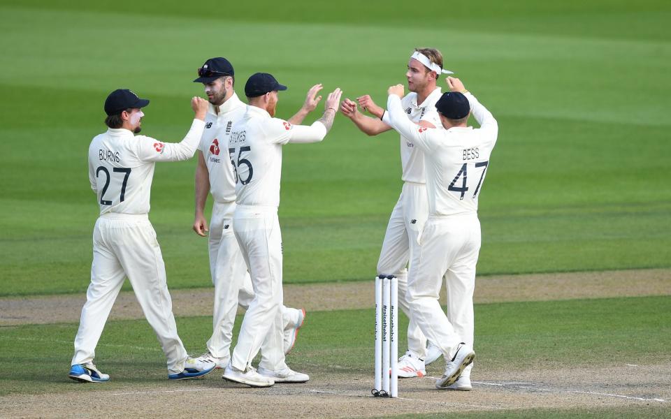 Stuart Broad of England celebrates with Ben Stokes and Dom Bess after taking the wicket of Shan Masood of Pakistan - GETTY IMAGES