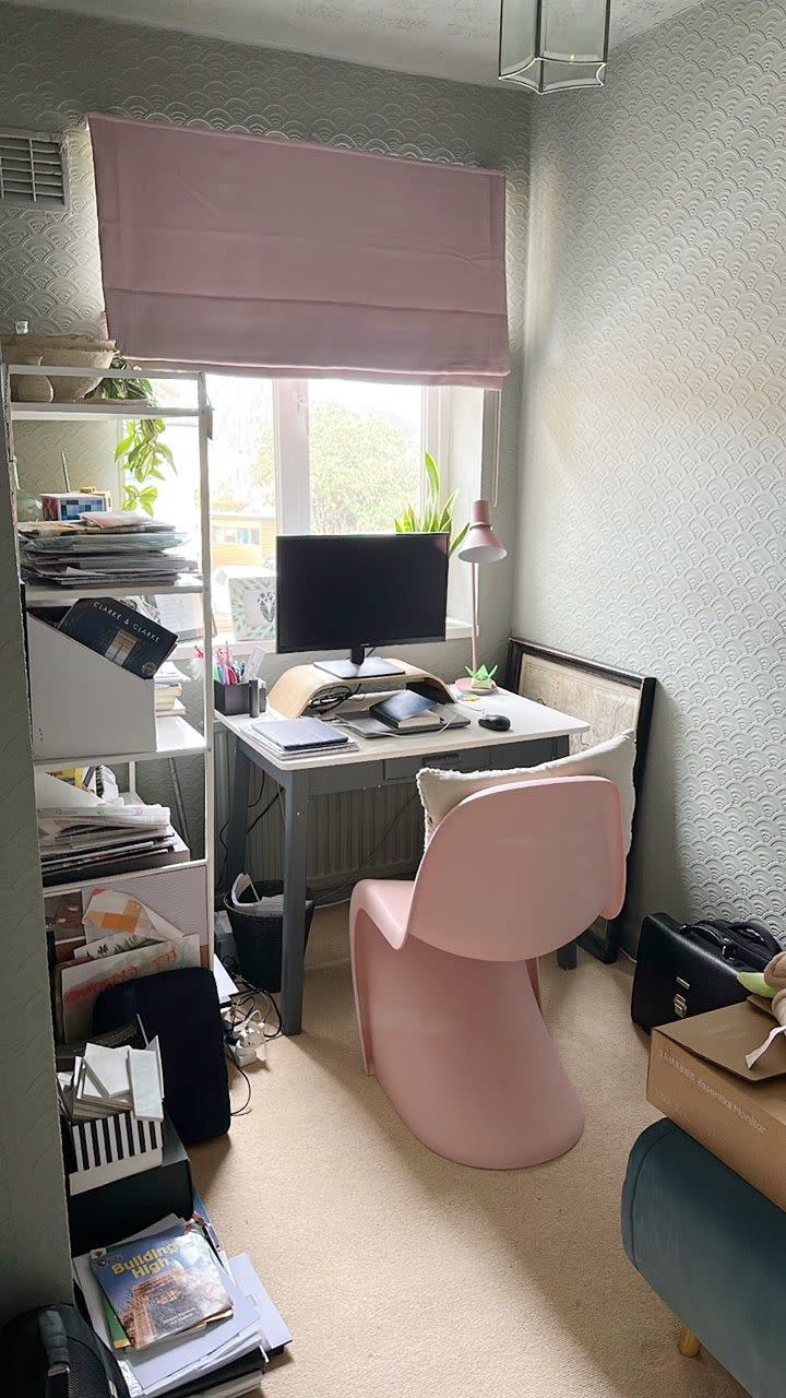 a room with a desk and a computer