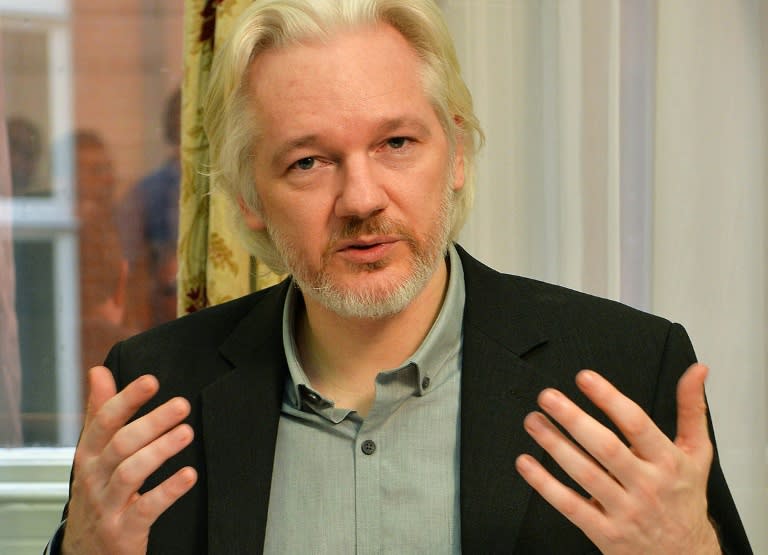 WikiLeaks founder Julian Assange gestures during a press conference inside the Ecuadorian Embassy in London on August 18, 2014