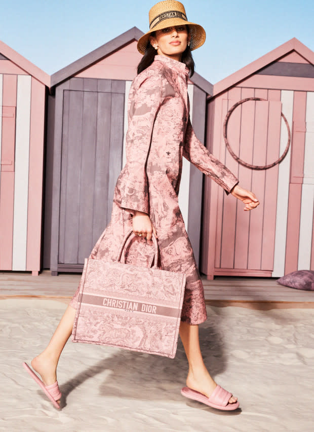 <p>Dior Dioriviera Book Tote, $3,350, <a href="https://www.dior.com/en_us/fashion/products/M1296ZRGO_M89E-medium-dior-book-tote-gray-and-pink-toile-de-jouy-reverse-embroidery-36-x-27.5-x-16.5-cm" rel="nofollow noopener" target="_blank" data-ylk="slk:available here;elm:context_link;itc:0;sec:content-canvas" class="link ">available here</a>; Dior Dioriviera Every-D Slide, $950, <a href="https://www.dior.com/en_us/fashion/products/KCQ861LBO_S62P-every-d-slide-pink-embossed-lambskin" rel="nofollow noopener" target="_blank" data-ylk="slk:available here;elm:context_link;itc:0;sec:content-canvas" class="link ">available here</a></p>