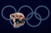 <p>Evgeny Kuznetsov of Team ROC competes in the Men's 3m Springboard Final on day eleven of the Tokyo 2020 Olympic Games at Tokyo Aquatics Centre on August 03, 2021 in Tokyo, Japan. (Photo by Clive Rose/Getty Images)</p> 