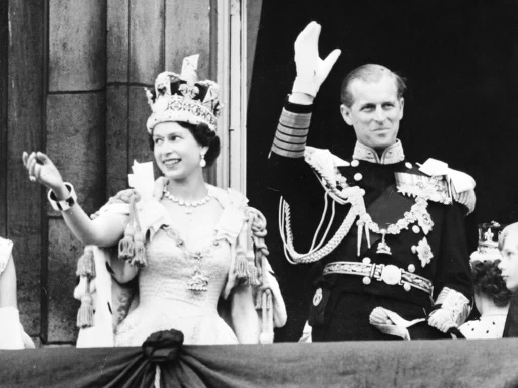 Queen Elizabeth II accompanied by Prince Philip on the day of her coronation in 1953 (INTERCONTINENTALE/AFP via Getty )