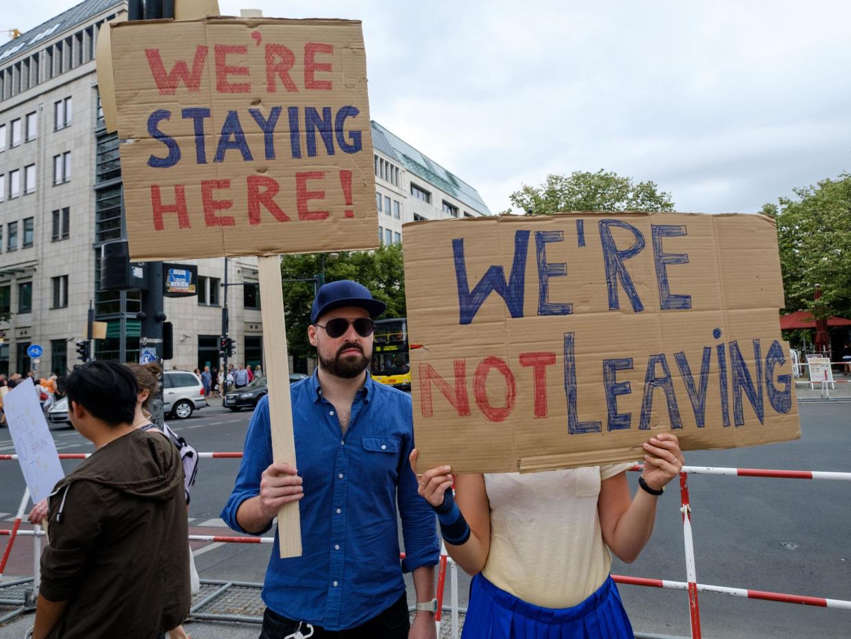 British expats hold up signs to protest Brexit: Getty