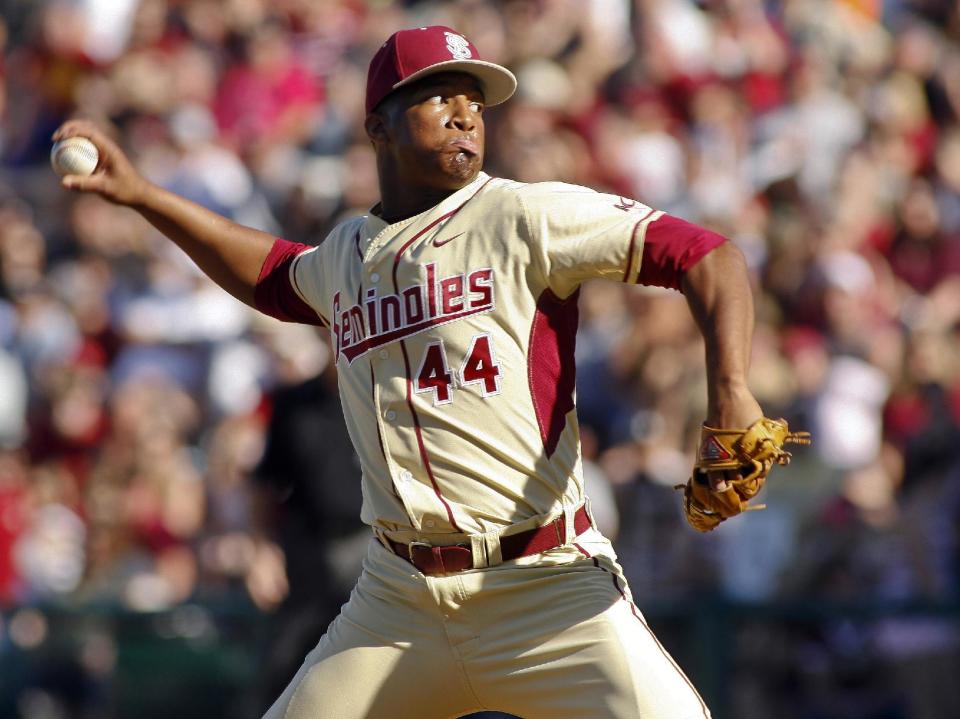 FILE - In this March 2, 2014, file photo, Florida State relief pitcher Jameis Winston throws in the ninth inning of an NCAA college baseball game against Miami in Tallahassee, Fla. The Florida State baseball team has indefinitely suspended Heisman Trophy winner Jameis Winston, who is a relief pitcher for the Seminoles. Baseball coach Mike Martin said in a statement Wednesday, April 30, 2014, that Winston was issued a citation the night before, but he did not give specifics. The Leon County Sheriff's Office has declined comment. (AP Photo/Phil Sears, File)