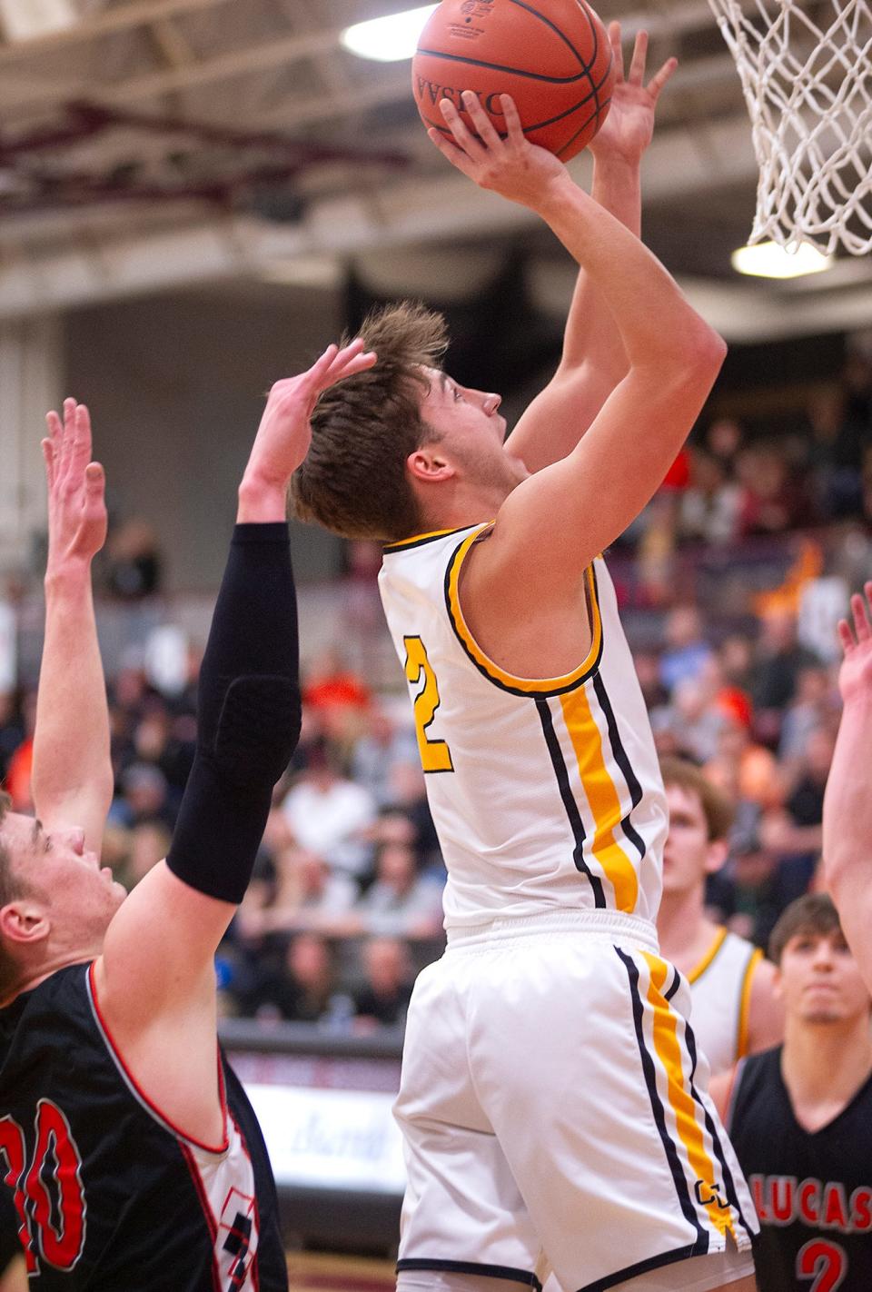 Colonel Crawford's Ethan Holt finishes at the basket.