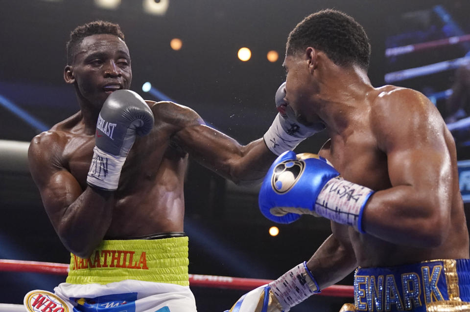 Jeremiah Nakathila, of Namibia, hits Shakur Stevenson in a WBO interim junior lightweight title fight Saturday, June 12, 2021, in Las Vegas. (AP Photo/John Locher)