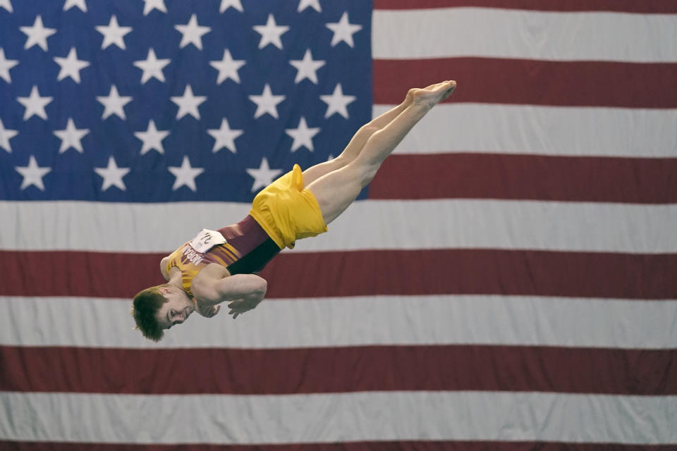 Michael Moran, representing the University of Minnesota, competes during the Winter Cup gymnastics event Sunday, Feb. 28, 2021, in Indianapolis. A junior from Morristown, New Jersey, Moran admits there were people within his inner circle who discouraged him from competing collegiately because they viewed his chosen sport as a “dying entity.” The University of Minnesota and the University of Iowa will stop offering it as a scholarship sport at the end of the month. (AP Photo/Darron Cummings)