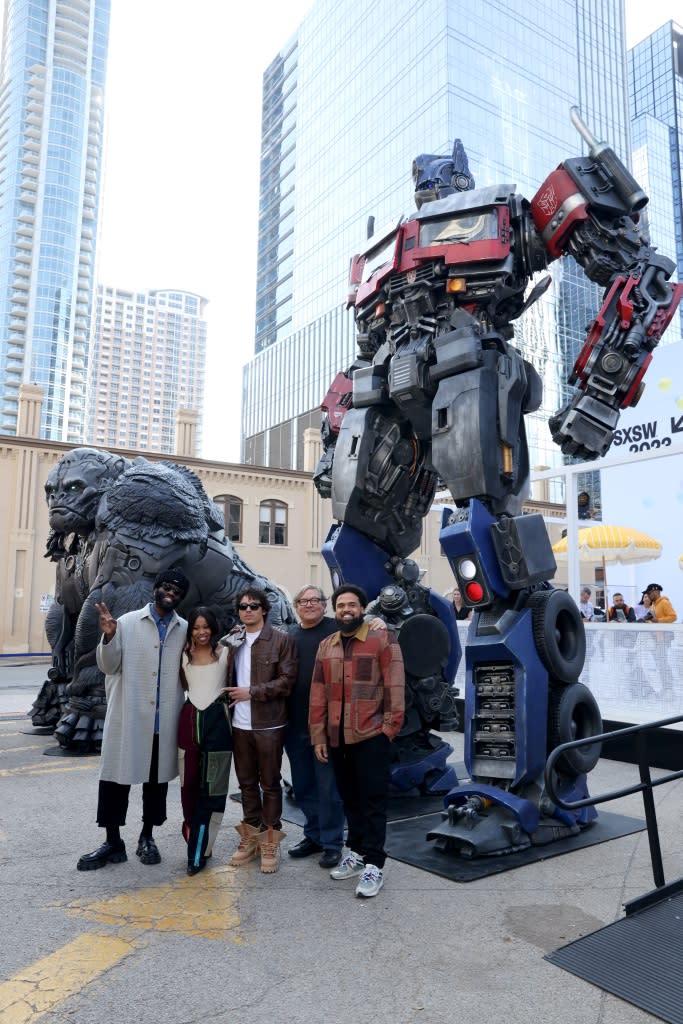 AUSTIN, TEXAS – MARCH 10: (L-R) Tobe Nwigwe, Dominique Fishback, Anthony Ramos, Lorenzo di Bonaventura, and Steven Caple Jr. attend the official unveiling of Optimus Prime and Optimus Primal statues from “Transformers: Rise of the Beasts” and introduction of Mirage, a Porsche Carrera 911 RS 3.8 followed by a Panel Discussion at the Porsche House at SXSW in Austin, TX on March 10, 2023. (Photo by Rick Kern/Getty Images for Paramount Pictures)