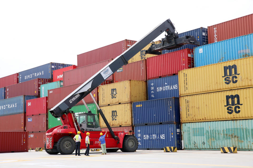 NANTONG, CHINA - JULY 18: A crane transfers a shipping container at Tonghai Port Area on July 18, 2019 in Nantong, Jiangsu Province of China. China's GDP expanded 6.3 percent year-on-year in the first half of this year, according to the National Bureau of Statistics on Monday. (Photo by Xu Congjun/Visual China Group via Getty Images)