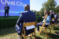 United Auto Workers President Ray Curry, seated at left, listens as Jim Farley, Ford president and CEO, speaks during a presentation on the planned factory to build electric F-Series trucks and the batteries to power future electric Ford and Lincoln vehicles Tuesday, Sept. 28, 2021, in Memphis, Tenn. The plant in Tennessee is to be built near Stanton, Tenn. (AP Photo/Mark Humphrey)