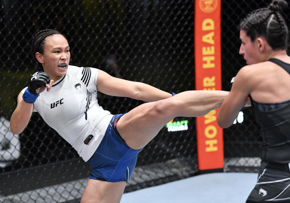 LAS VEGAS, NEVADA – MAY 08: (L-R) Michelle Waterson kicks Marina Rodriguez of Brazil in a flyweight fight during the UFC Fight Night event at UFC APEX on May 08, 2021 in Las Vegas, Nevada. (Photo by Chris Unger/Zuffa LLC)