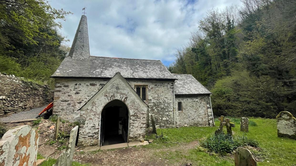 St Beuno's Church in Culbone seen from the outside with graves also visible