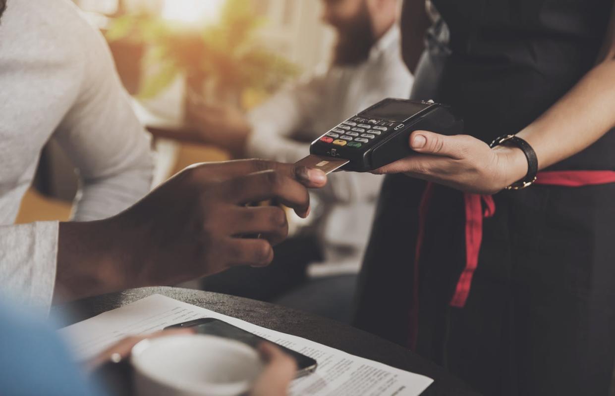 <span class="caption">Some people argue the poor service is because of a stereotype that Black people tip less. </span> <span class="attribution"><a class="link " href="https://www.gettyimages.com/detail/photo/young-african-american-is-calculated-credit-card-royalty-free-image/1086131330" rel="nofollow noopener" target="_blank" data-ylk="slk:PavelVinnik/iStock via Getty Images;elm:context_link;itc:0;sec:content-canvas">PavelVinnik/iStock via Getty Images</a></span>