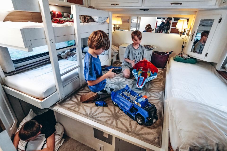 the children playing in their bedroom in the walker family RV