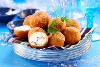 <p>Our mouths are already watering from the sound of these fried cheese balls. Typically found at beach bars around the island of <a href="https://www.curacao.com/en/" rel="nofollow noopener" target="_blank" data-ylk="slk:Curaçao;elm:context_link;itc:0;sec:content-canvas" class="link ">Curaçao</a>, these cheese balls are made using Gouda cheese. They’re the epitome of a comfort food dish as this snack will hold you over until <a href="https://www.countryliving.com/life/entertainment/a32316525/blue-bloods-virtual-reagan-family-dinner/" rel="nofollow noopener" target="_blank" data-ylk="slk:dinnertime;elm:context_link;itc:0;sec:content-canvas" class="link ">dinnertime</a>.</p><p><strong>Get the recipe at <a href="https://www.antillean-eats.com/Recipes/Appetizer/Cheese-Balls/Kaasbal/" rel="nofollow noopener" target="_blank" data-ylk="slk:Antillean Eats;elm:context_link;itc:0;sec:content-canvas" class="link ">Antillean Eats</a>.</strong></p>