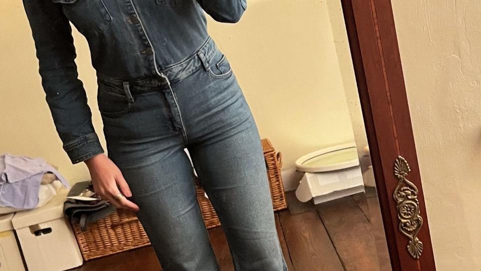 A photo of Carrie Johnson in a denim jumpsuit