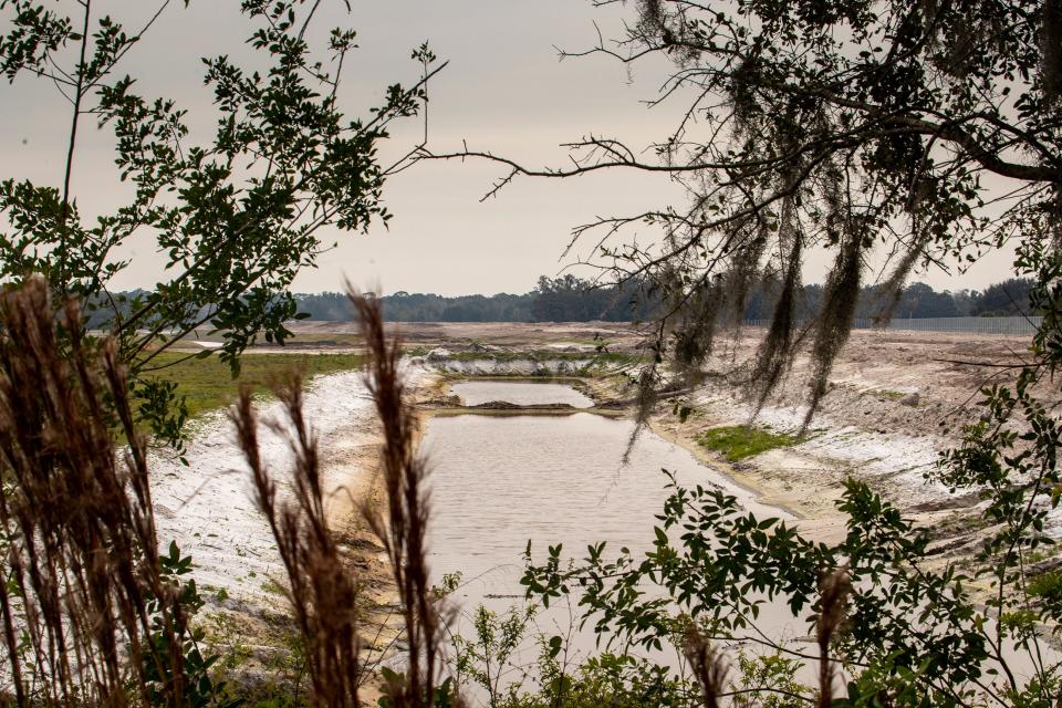 A borrow pit is show at the construction site for the Central Polk Parkway just south of Marshall Hampton Reserve near Winter Haven. The toll road will connect the Polk Parkway from the C.R. 540 (Winter Lake Road) interchange to U.S. 17 near the Bartow Executive Airport.