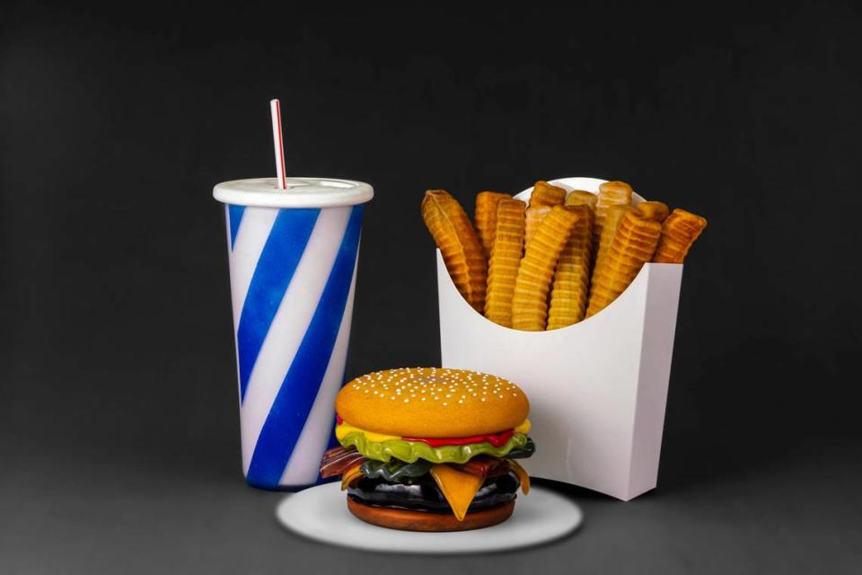 “Order Up! The Pop Art of John Miller” at the Lowe Art Museum features burgers, fries and diner settings blown in glass. Courtesy of Lowe Art Museum