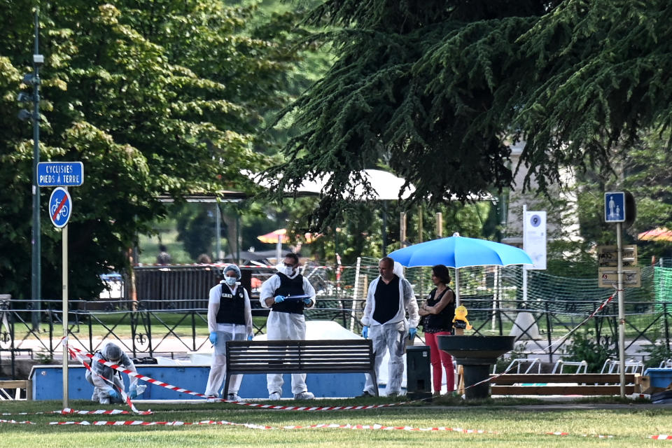 French forensic police officers work at the scene of a stabbing attack in the 'Jardins de l'Europe' park in Annecy, in the French Alps, on June 8, 2023.