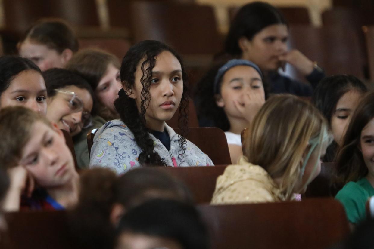 Fifth-grade violinist Isabella Moorer listens to an interactive performance at Washington Irving Intermediate School in Tarrytown April 11, 2024. "I really liked this performance because it shows like a lot of the fourth-graders that just started this year, like what all these instruments are about and how you feel once you play them, like all the emotion. I think this helped me to practice trying to put emotion into my playing," she said.