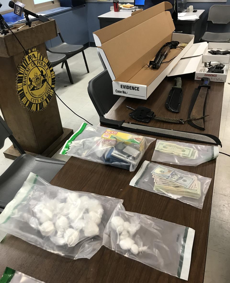 In this file photo, Erie city and county drug investigators display about 1 pound of suspected crystal methamphetamine, along with three guns, cash and suspected drug paraphernalia, seized during the search of an Erie residence on Nov. 13, 2019, in an investigation fueled by neighborhood complaints. A new federal designation is designed to help law enforcement combat illegal drug trafficking in the Erie area.