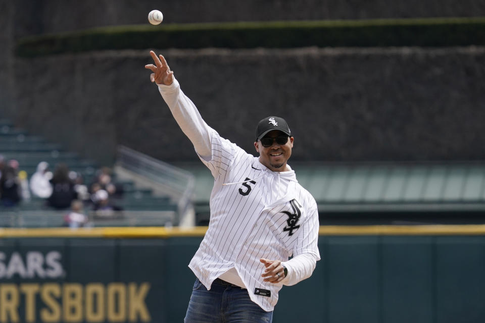Chicago Bears general manager Ryan Poles throws out a ceremonial first pitch before a baseball game between the Tampa Bay Rays and the Chicago White Sox in Chicago, Saturday, April 16, 2022. (AP Photo/Nam Y. Huh)