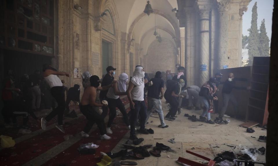 Palestinians clash with Israeli security forces at the Al Aqsa Mosque compound in Jerusalem’s Old City on May 10.