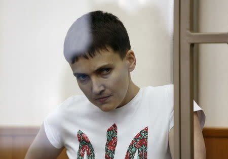 Former Ukrainian army pilot Nadezhda Savchenko looks out from a glass-walled cage as she attends a court hearing in the southern border town of Donetsk in Rostov region, Russia, March 9, 2016. REUTERS/Stringer