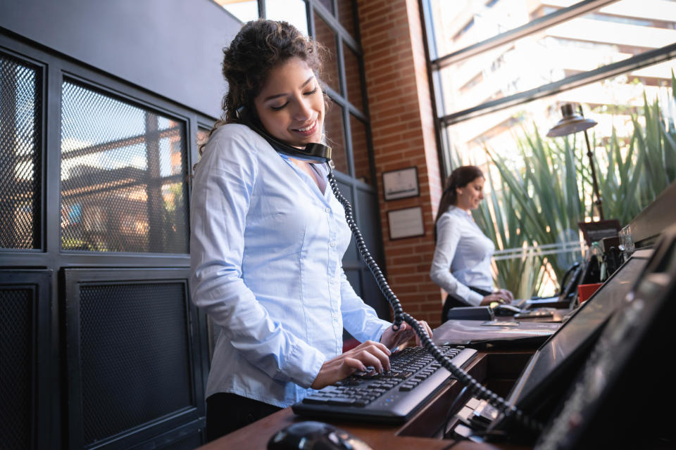 hotel front desk on the phone