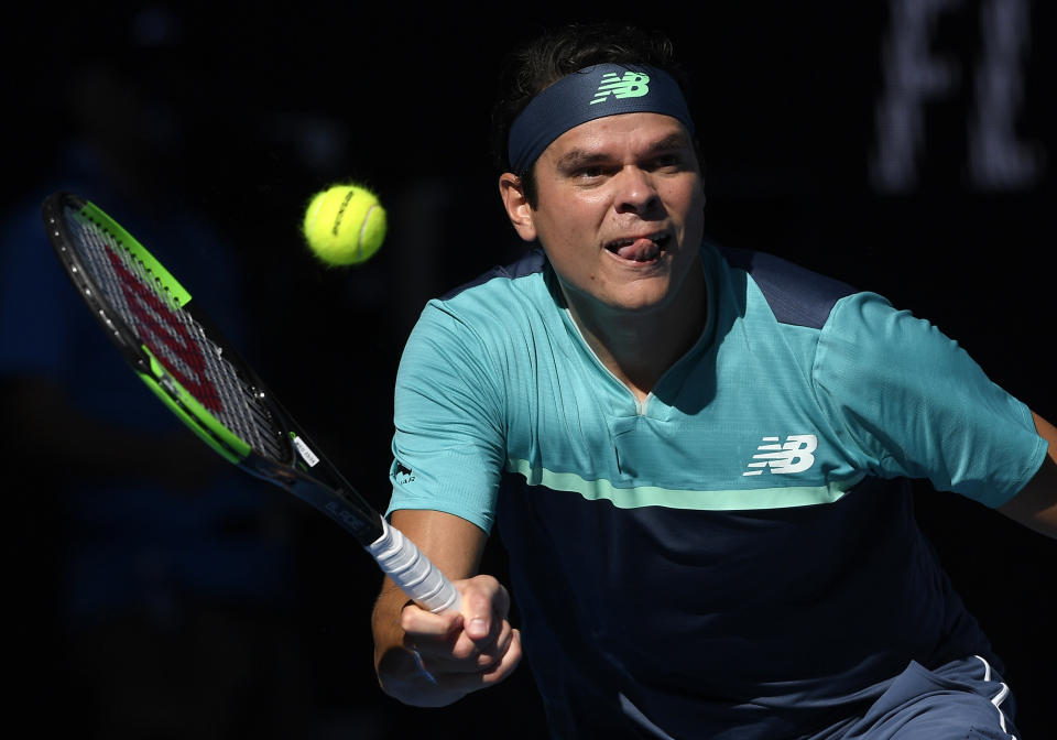 Canada's Milos Raonic makes a forehand return to France's Lucas Pouille during their quarterfinal match at the Australian Open tennis championships in Melbourne, Australia, Wednesday, Jan. 23, 2019. (AP Photo/Andy Brownbill)