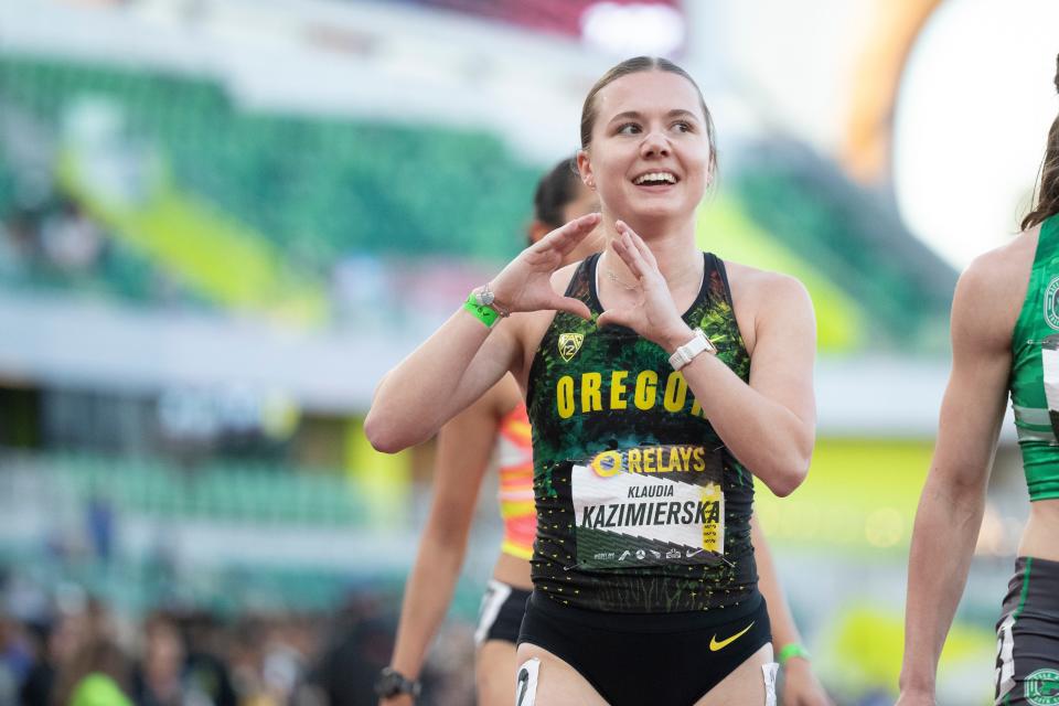 Oregon’s Klaudia Kazimierska signals to the crowd after finishing second in the women’s 800 meters during the Oregon Relays Friday, April 19, 2024, at Hayward Field in Eugene, Ore.